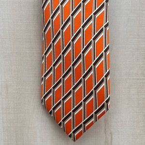 Hermes orange and white 62•3 in. This tie has been gently and rarely used.